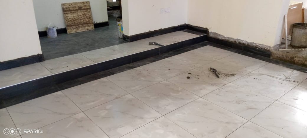 Floor tiling with raised step and border